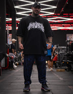 Model wearing patterned blue pants in a gym setting