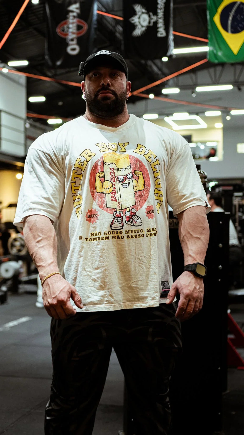 Model wearing patterned pants in a gym setting